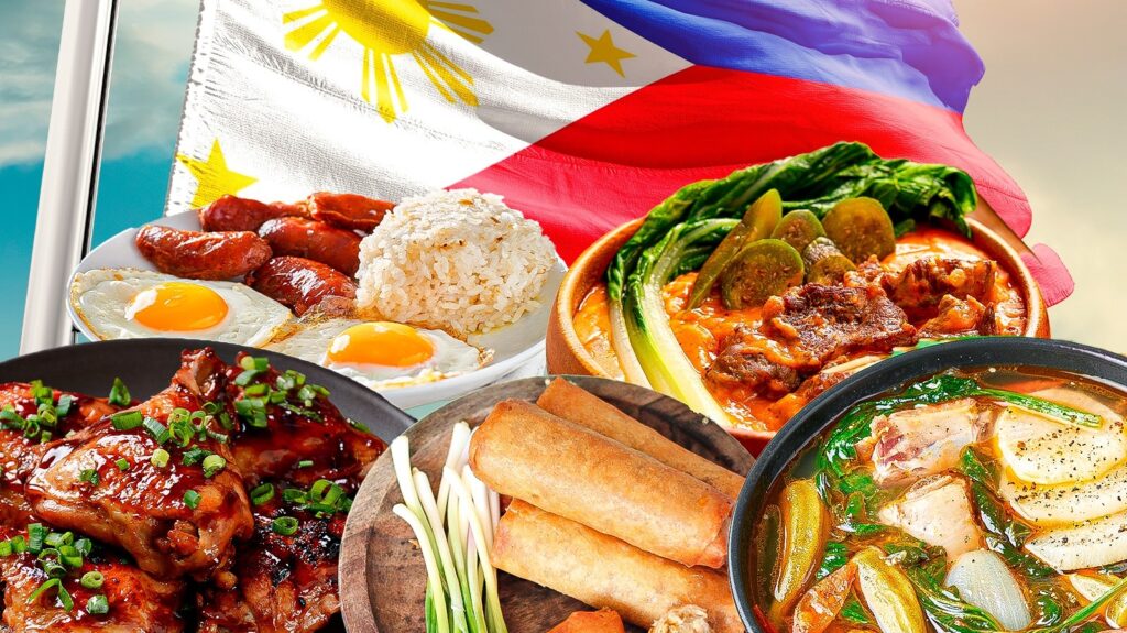 Traditional Filipino dishes like adobo, sinigang, and lechon on a wooden table.