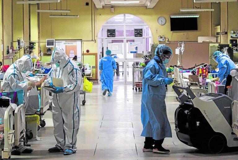 Foreign patient consulting with a Filipino doctor in a modern private hospital in Manila
