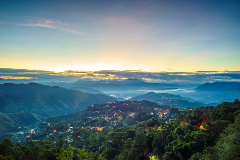 Panoramic view of pine-covered mountains and cool mist in Baguio City