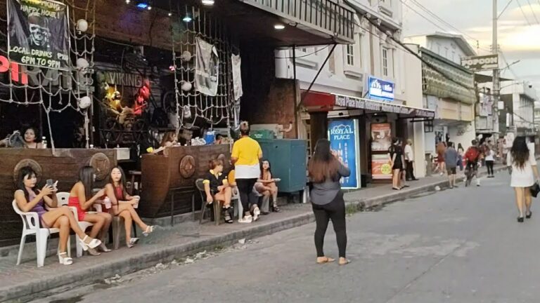Angeles City Walking Street at night with neon lights, bars, and crowds